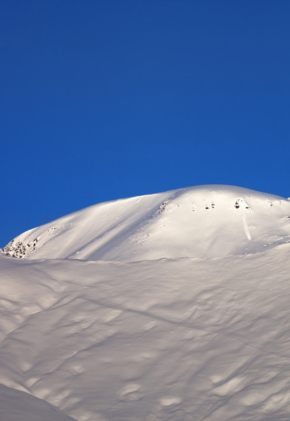 Off-piste slope and blue cloudless sky in nice winter morning - Photo, image