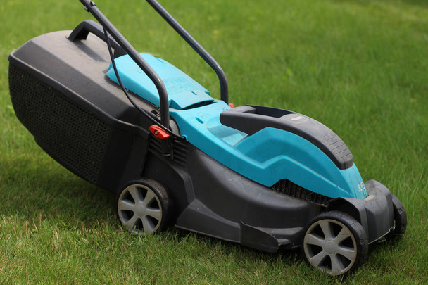 The lawn mower is on the grass - Photo, Image