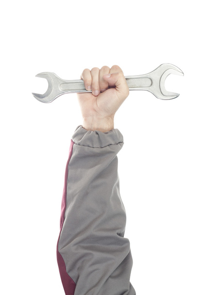 Ремонт рукою з гайковим ключем
 - Фото, зображення