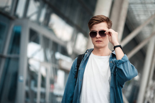 Portrait of a young handsome boy in sunglasses - 写真・画像