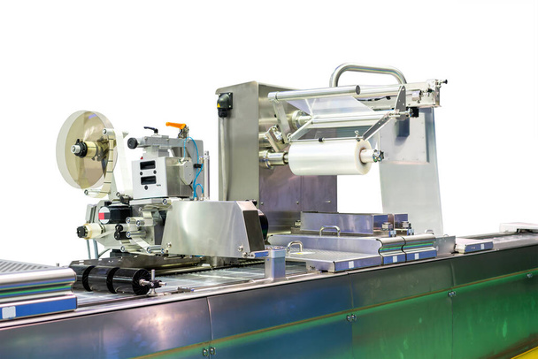 High technology and modern new automatic food or other packing and labeling machine with plastic film coil for industrial commercial isolated on white background with clipping path - Photo, Image