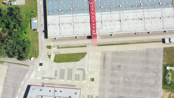 A huge shopping center and parking near it. view from above.aerial photography. Empty - Footage, Video
