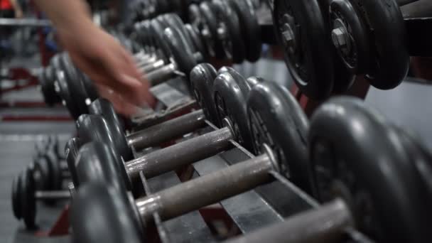 Footage of rack with dumbbells in fitness gym - Footage, Video