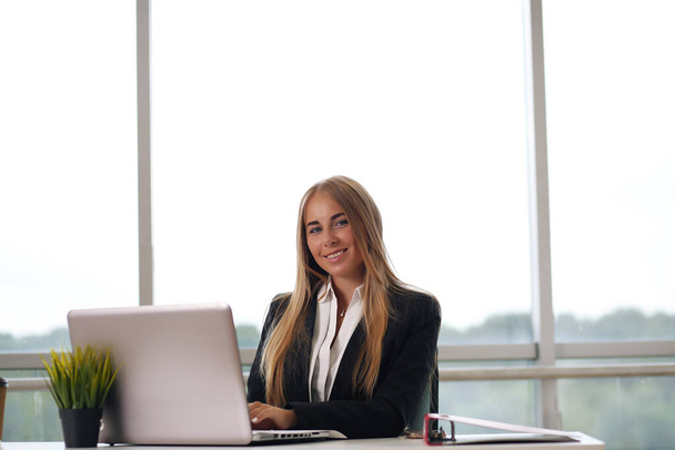 Modern business woman in the office blonde - Photo, Image