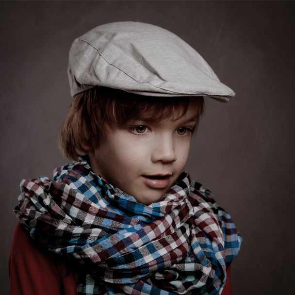 Portrait of boy on brown background, studio - Photo, image