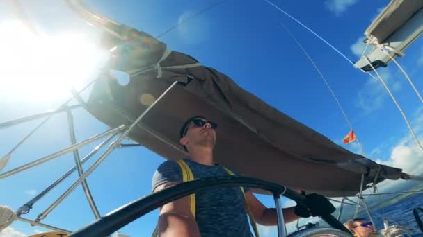 A man in sunglasses is riding across the sea in the speedboat - Filmati, video