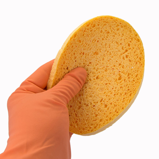 Hand with cleaning sponge isolated against white background - Photo, Image
