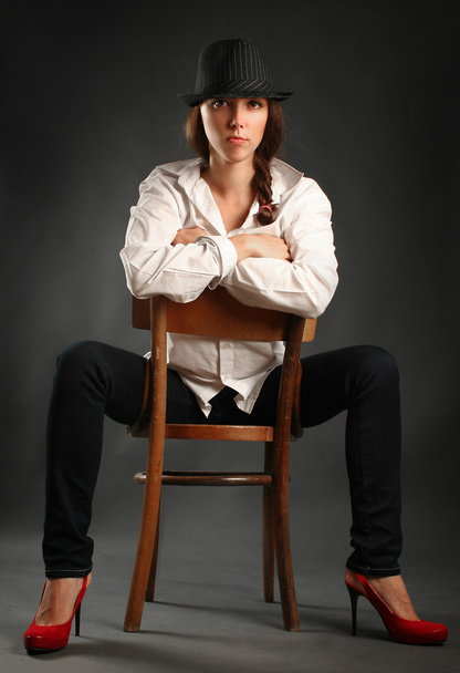 Woman on chair - Фото, изображение