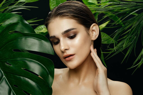 Pure jungle skin spa treatments bare shoulders green leaves  - Photo, Image