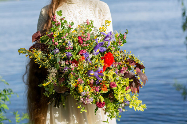 bouquet of flowers on the beach. flowers in the garden - Photo, Image