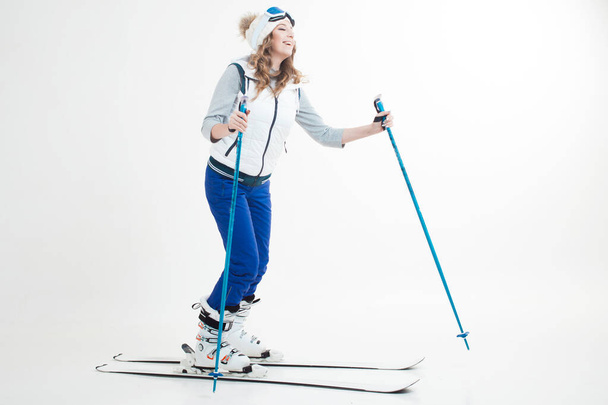 Skier maneuvers on mountain skis, photos on a white background in the Studio, - Foto, Bild