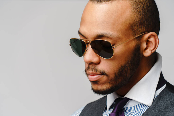African-American businessmanman wearing glasses portrait over grey background - Zdjęcie, obraz