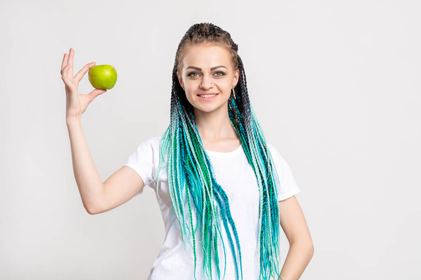 positive woman bright blue hair braids green apple - Photo, image