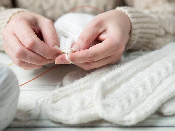 Woman knits winter warm clothes closeup - Φωτογραφία, εικόνα
