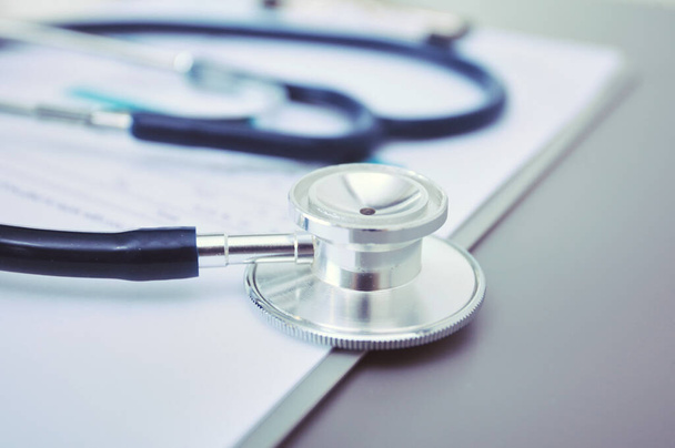 Medical equipment: blue stethoscope and tablet on white background. Medical equipment - Foto, Imagem