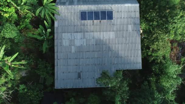 Aerial drone camera view of residential house in the forest,ecological energy power nature concept - Footage, Video