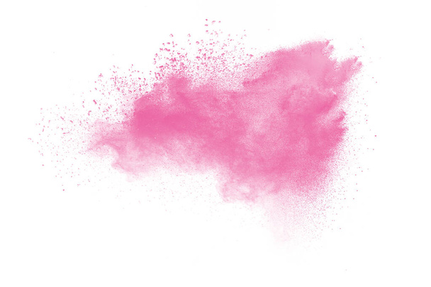 Вибух рожевого порошку на білому тлі. Рожева хмара розбризкування пилу. Запущено барвисті частинки
. - Фото, зображення