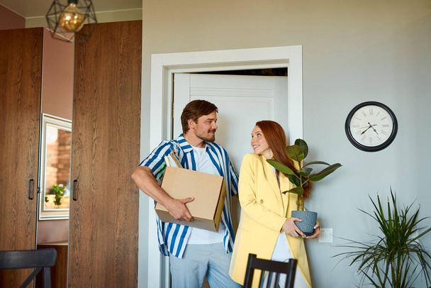 portrait of adorable lovely couple moved to a new apartment - 写真・画像