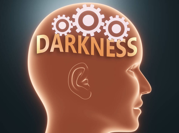 Escuridão dentro da mente humana - retratada como palavra Escuridão dentro de uma cabeça com rodas dentadas para simbolizar que Escuridão é o que as pessoas podem pensar e que afeta seu comportamento, ilustração 3d
 - Foto, Imagem