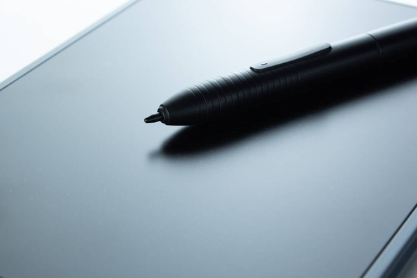 Digital pen lies on graphics tablet, digital drawing - Photo, Image