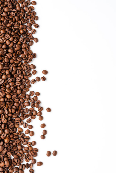 Roasted coffee beans isolated on white background. Close up - Photo, Image