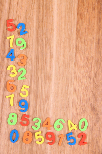 Colorful numbers on wooden background - Photo, Image