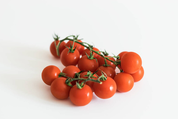 fresh red tomatoes on a green branch - Photo, Image