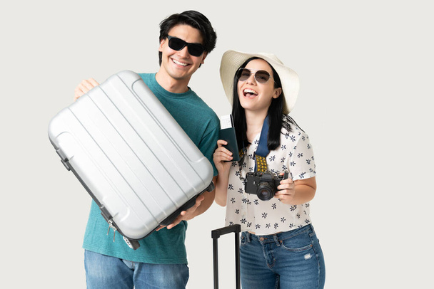 Cheerful boyfriend and girlfriend with luggage during vacation - Photo, Image