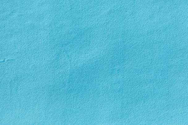 薄い青で塗られた石膏壁の背景 - 写真・画像