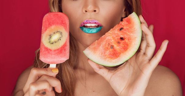 Art lips of beautiful brunette woman with homemade watermelon ice cream with kiwi or popsicle - Zdjęcie, obraz