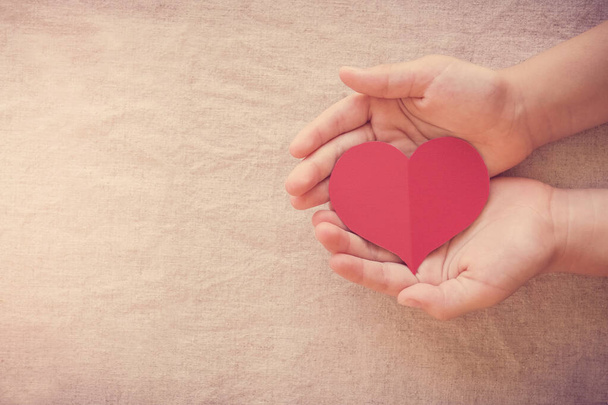 hands and red heart, health insurance, donation and charity concept - Foto, Imagem