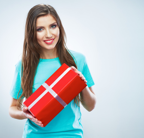 Young happy smiling woman hold red gift box. - Фото, изображение