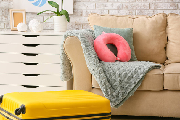 Travel pillow and suitcase in room - Photo, Image