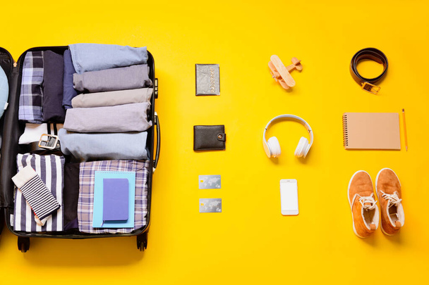 Set of travel accessories on color background - 写真・画像