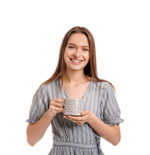 Beautiful young woman with cup of tea on white background - Fotografie, Obrázek