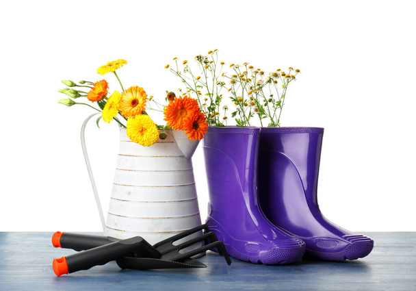 Gardening tools on table against white background - Foto, Imagem