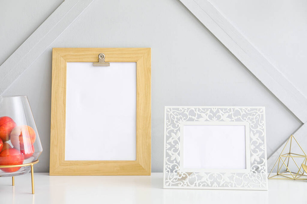 Photo frames on table in room - Foto, Bild