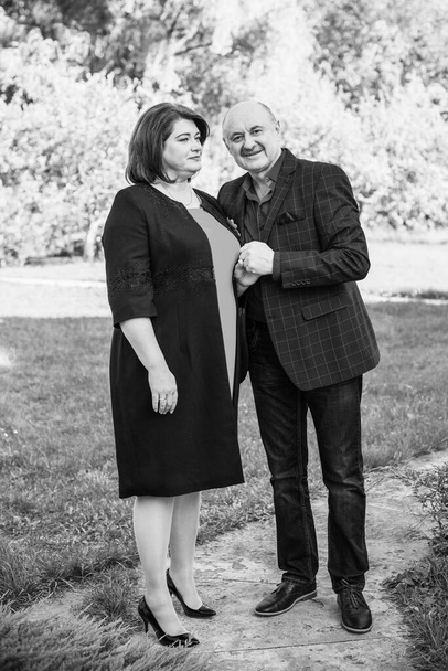 Elegant mature couple in autumn park, Concept of relationship older people - Fotografie, Obrázek