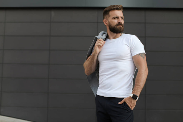 Portrait of a casual man with beard outdoor - Foto, Imagen
