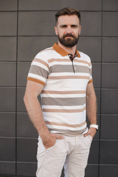 Portrait of a casual man with beard outdoor - 写真・画像
