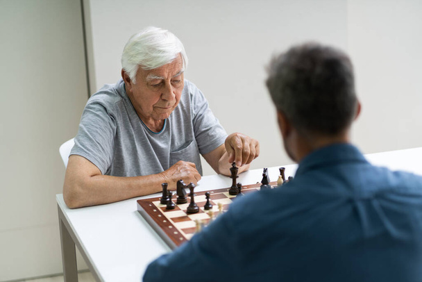 Elderly Senior Playing Chess Table Board Game - Photo, Image