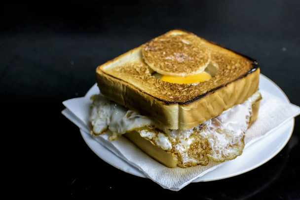 egg sandwich with a hole and an egg inside - Photo, Image