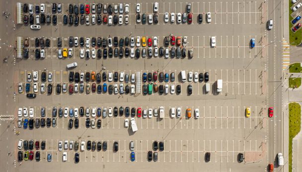Parked cars in the Parking lot near the shopping center. Aerial view - Photo, Image