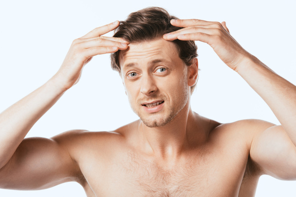 Confused shirtless man touching hair isolated on white - Fotografie, Obrázek
