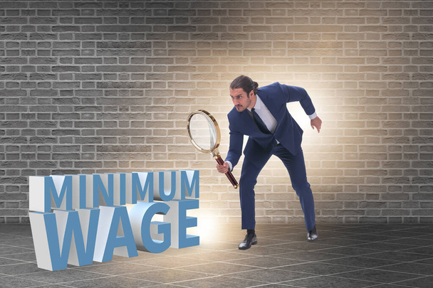 Concept of minimum wage with businessman - Photo, Image