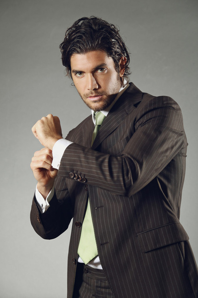 Handsome model posing with cufflinks - Photo, image