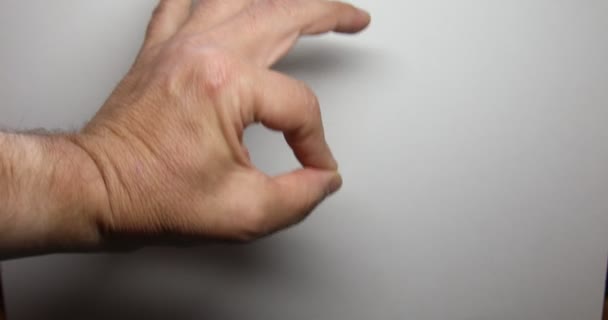 Man signs with hand and fingers - Footage, Video
