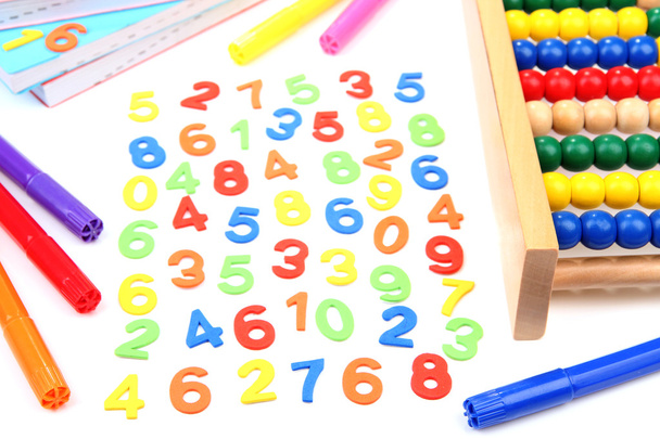 Colorful numbers, abacus, books and markers, isolated on white - Foto, Bild