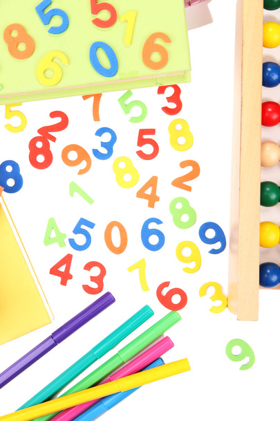 Colorful numbers, abacus, books and markers, isolated on white - Фото, изображение
