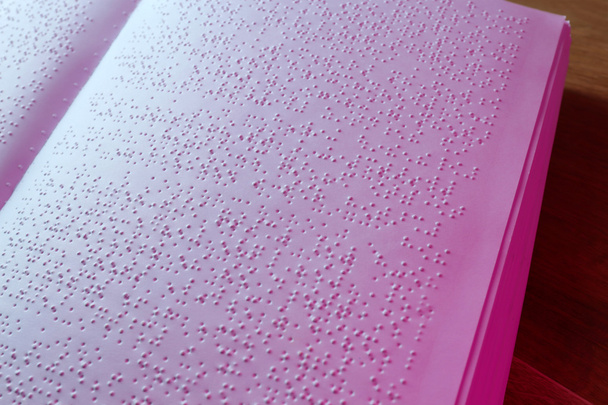 Book written in braille alphabet for blind people - Фото, изображение